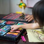 toddler-choosing-colours-while-drawing-on-a-paper-at-home-.jpg